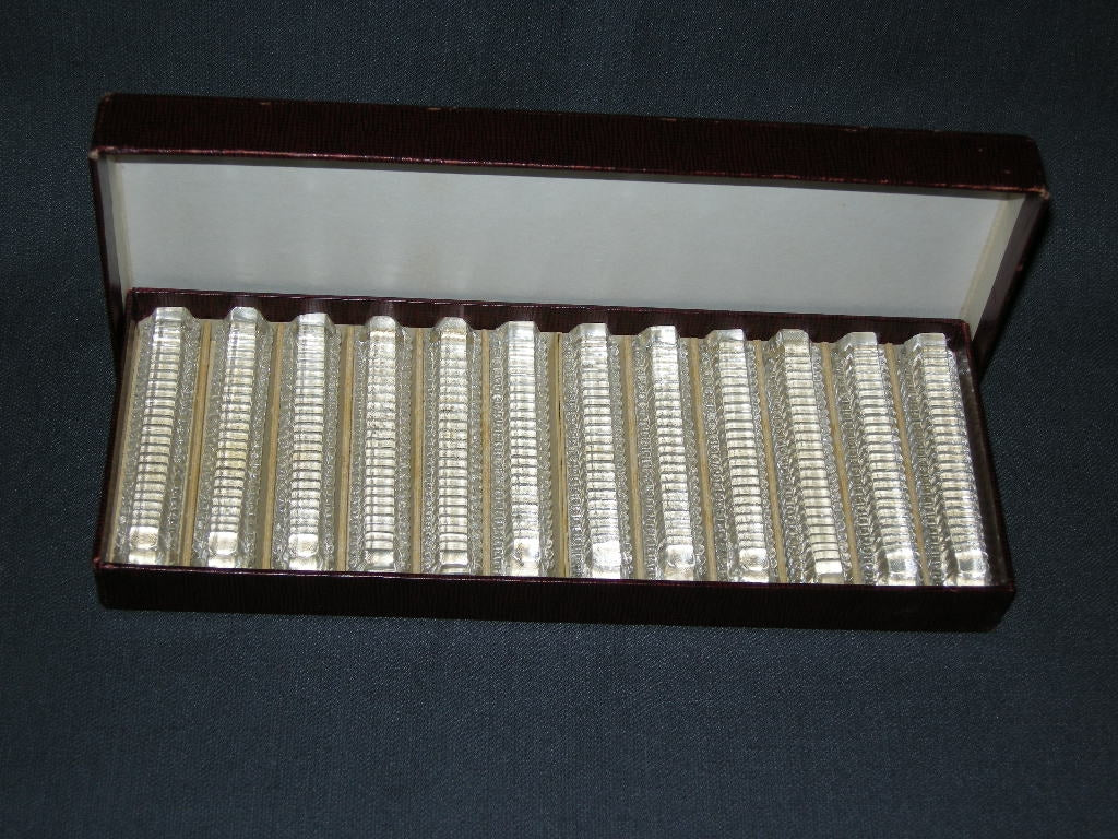 Gebruikt glas / kristal messenleggers 006. 12 stuks in origineel doosje