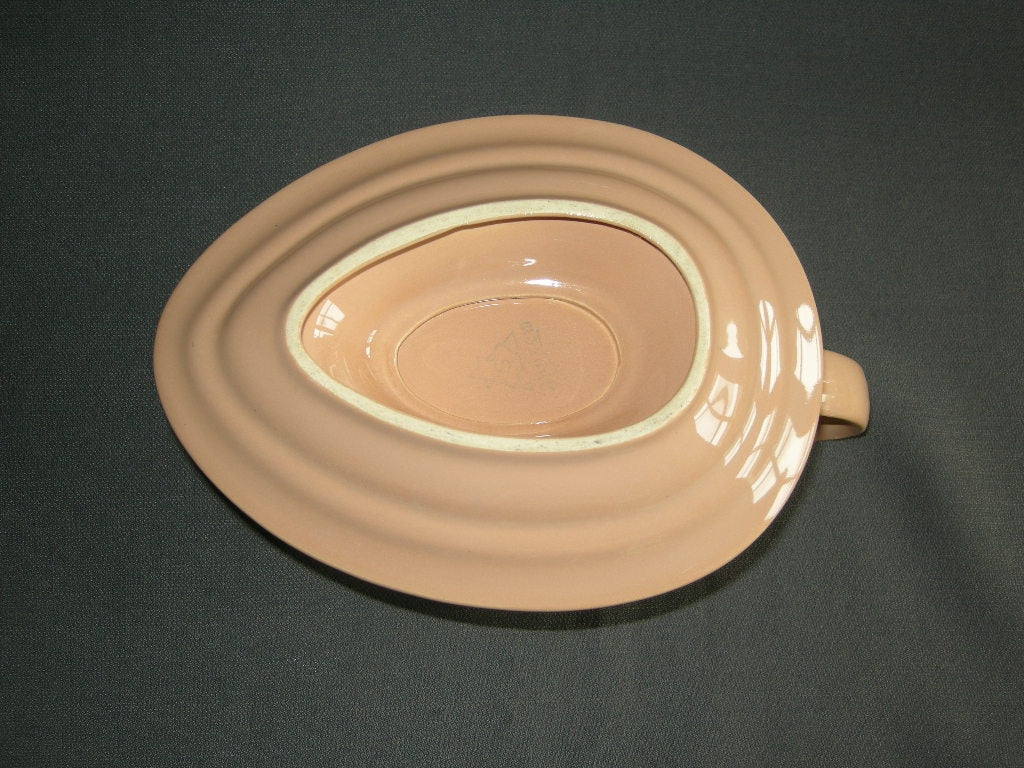 Huizen pastel zalmrose sauskom