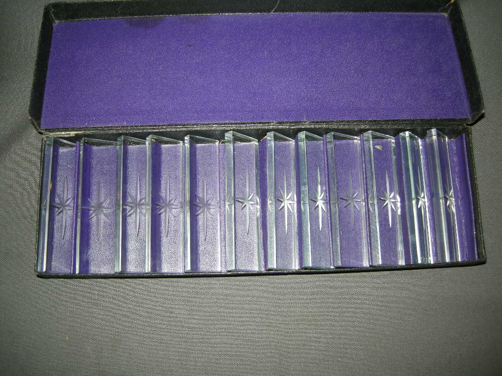 glas - kristal 018. 12 messenleggers in originele doos