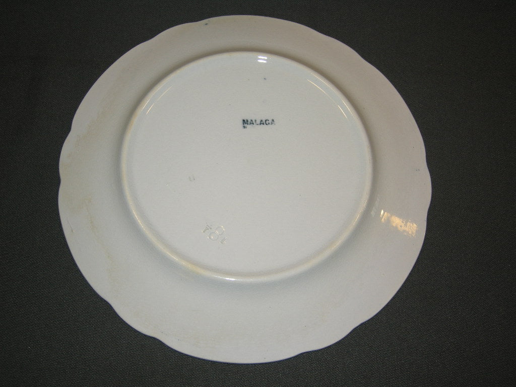 Petrus Regout Malaga blauw met geschulpte rand bord a O23,5 cm. met lichte verkleurde plekjes