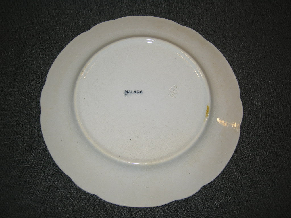 Petrus Regout Malaga blauw met geschulpte rand bord c O23,5 cm. met lichte verkleurde plekjes