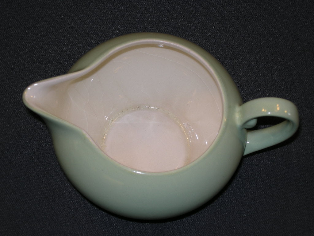 MOSA roomwit met pastelgroen melkkannetje