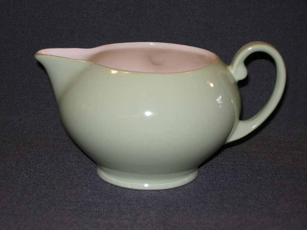 MOSA roomwit met pastelgroen melkkannetje