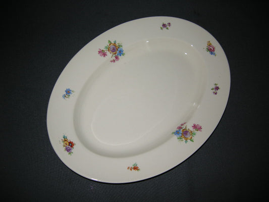 Petrus Regout Boudewijn 3262 donker vleesschaal 34,5 x 25 cm. gele bloem