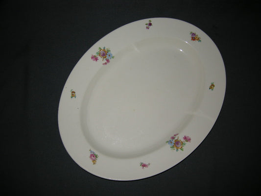 Petrus Regout Boudewijn 3262 donker vleesschaal 39,5 x 30,5 cm. gele bloem